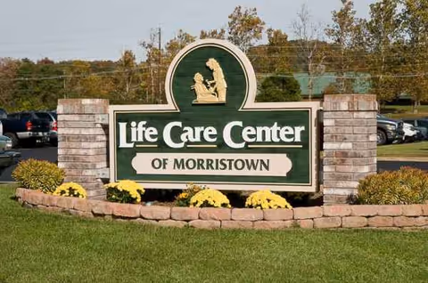 Front entrance sign for Life Care Center of Morristown with brick pillars and landscaping.
