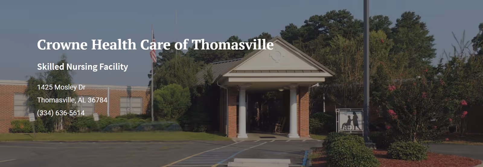Entrance of Crowne Health Care of Thomasville, a single-story brick skilled nursing facility with a columned portico, driveway, and landscaped grounds.