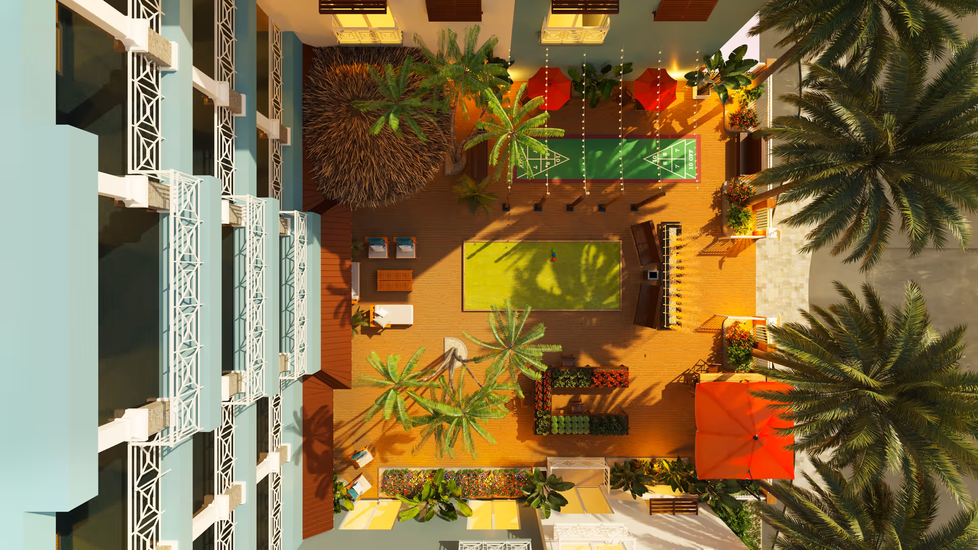 Aerial view of an outdoor courtyard area at Bahama Bay Club Luxury Senior Living, featuring palm trees, shuffleboard courts, bocce ball court, seating areas with chairs and tables, and vibrant landscaping with flowers and plants.