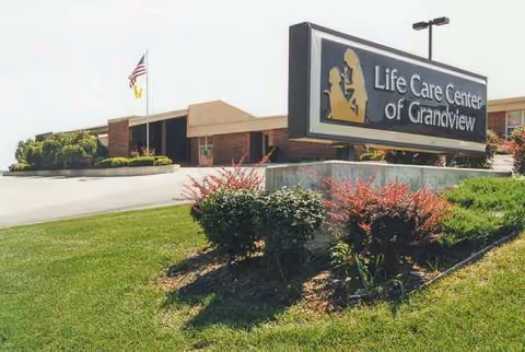 Exterior view of Life Care Center of Grandview with sign and landscaped front.