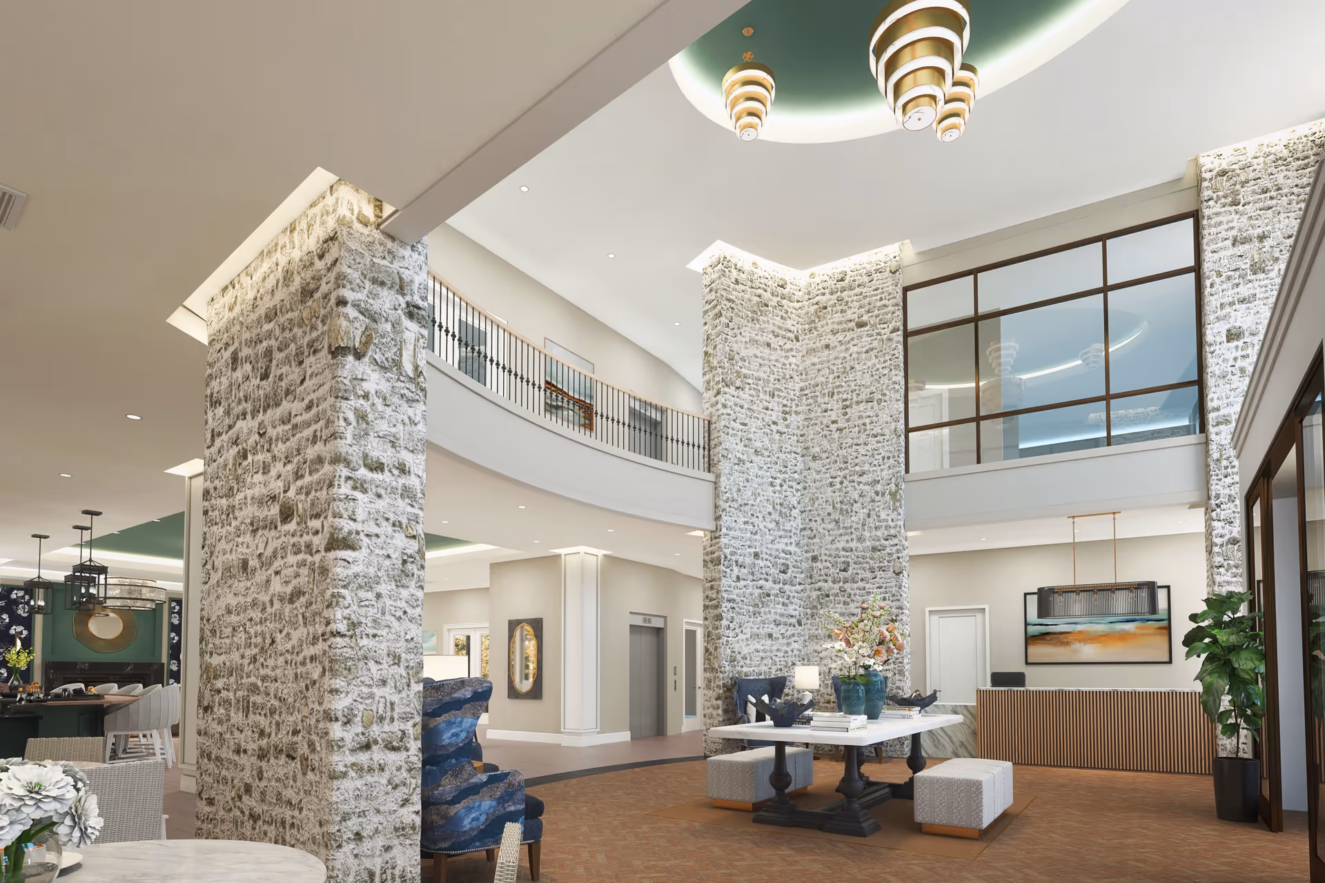 Spacious and elegant senior living facility lobby with tall stone pillars, a high ceiling with modern chandeliers, a reception desk with artwork behind it, seating areas with blue patterned chairs and ottomans, and decorative flowers on a central table.