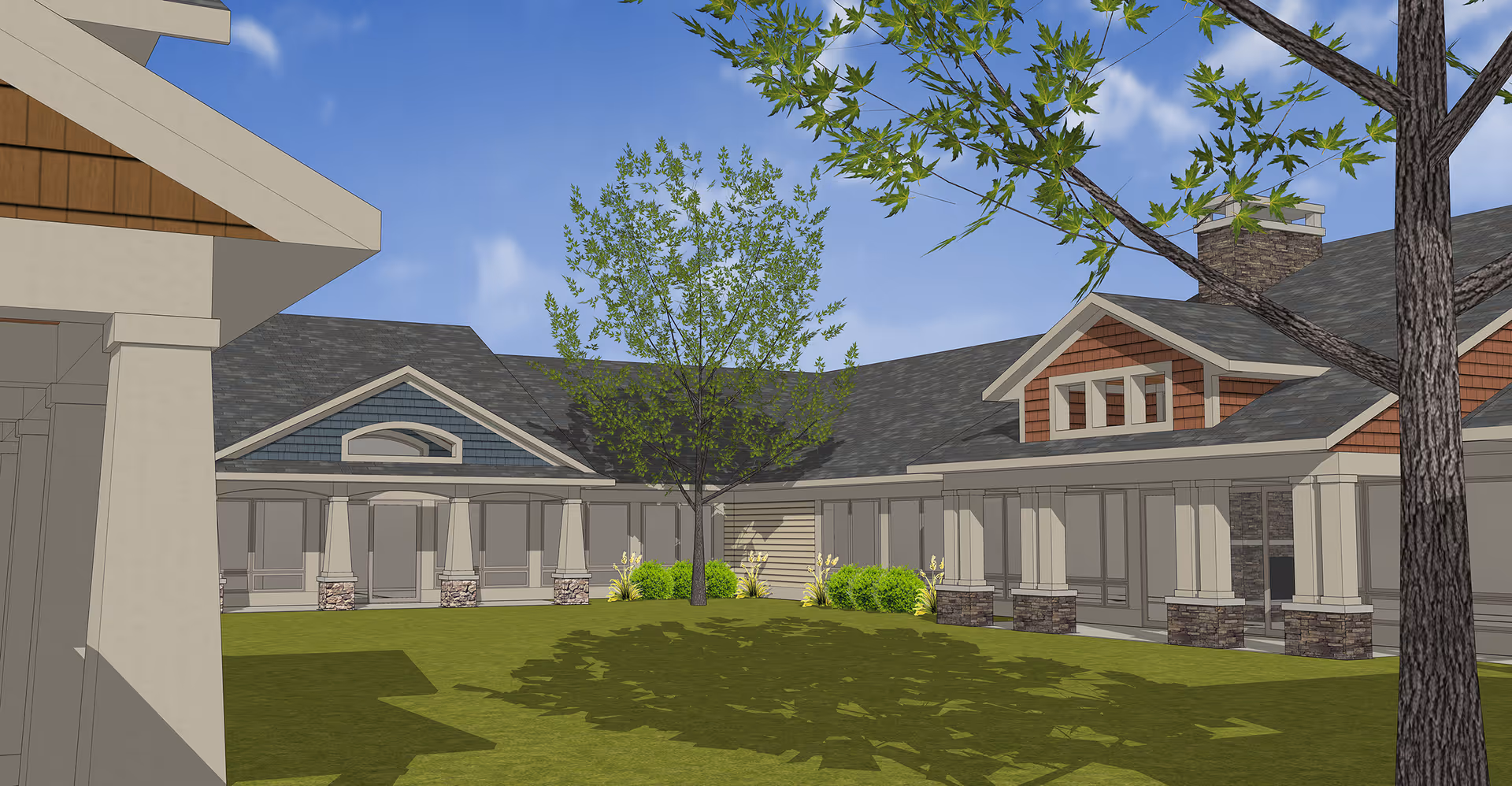 Exterior view of a senior living facility courtyard with a green lawn, trees, and a building with covered walkways supported by columns. The building features a combination of stone and wood siding under a pitched roof with dormer windows.