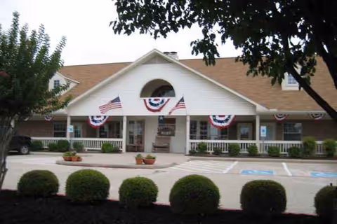 Sodalis Flower Mound front entrance with patriotic bunting and trimmed shrubs