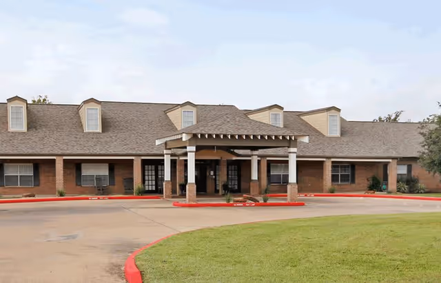 Front view of Sodalis Wharton with a covered entrance and landscaped area.