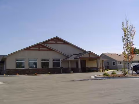 Front exterior view of Copper Springs Senior Living with parking and landscaped grounds.