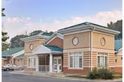 Exterior view of Waldorf Center senior living facility front entrance with brick facade