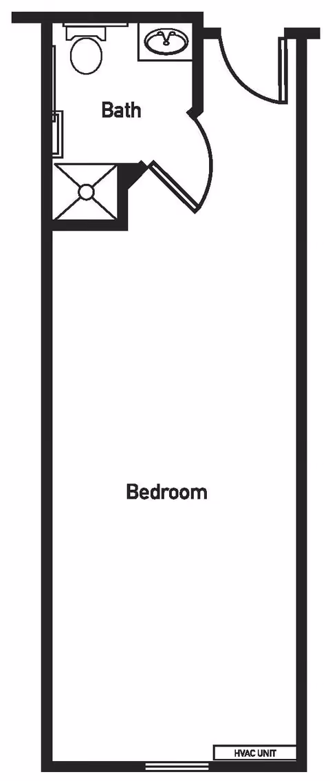 Black and white floor plan layout showing a bedroom area with an attached bathroom. The bathroom includes a toilet, sink, and shower. The bedroom area is a large rectangular space with an HVAC unit indicated at one end.
