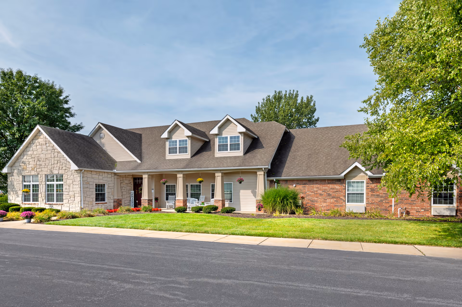 Front exterior view of Brookdale Valparaiso, a senior living facility with stone and brick facade.