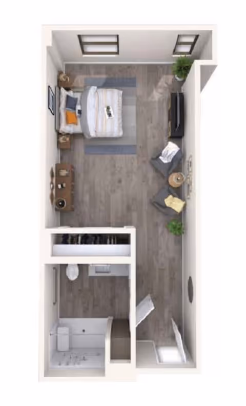 Top-down floor-plan rendering of a studio apartment showing a bed, living area, closet and bathroom.