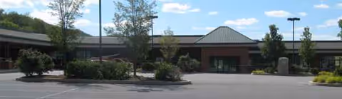 Exterior view of Abington Manor at Morgan Hill, a single-story senior living building.