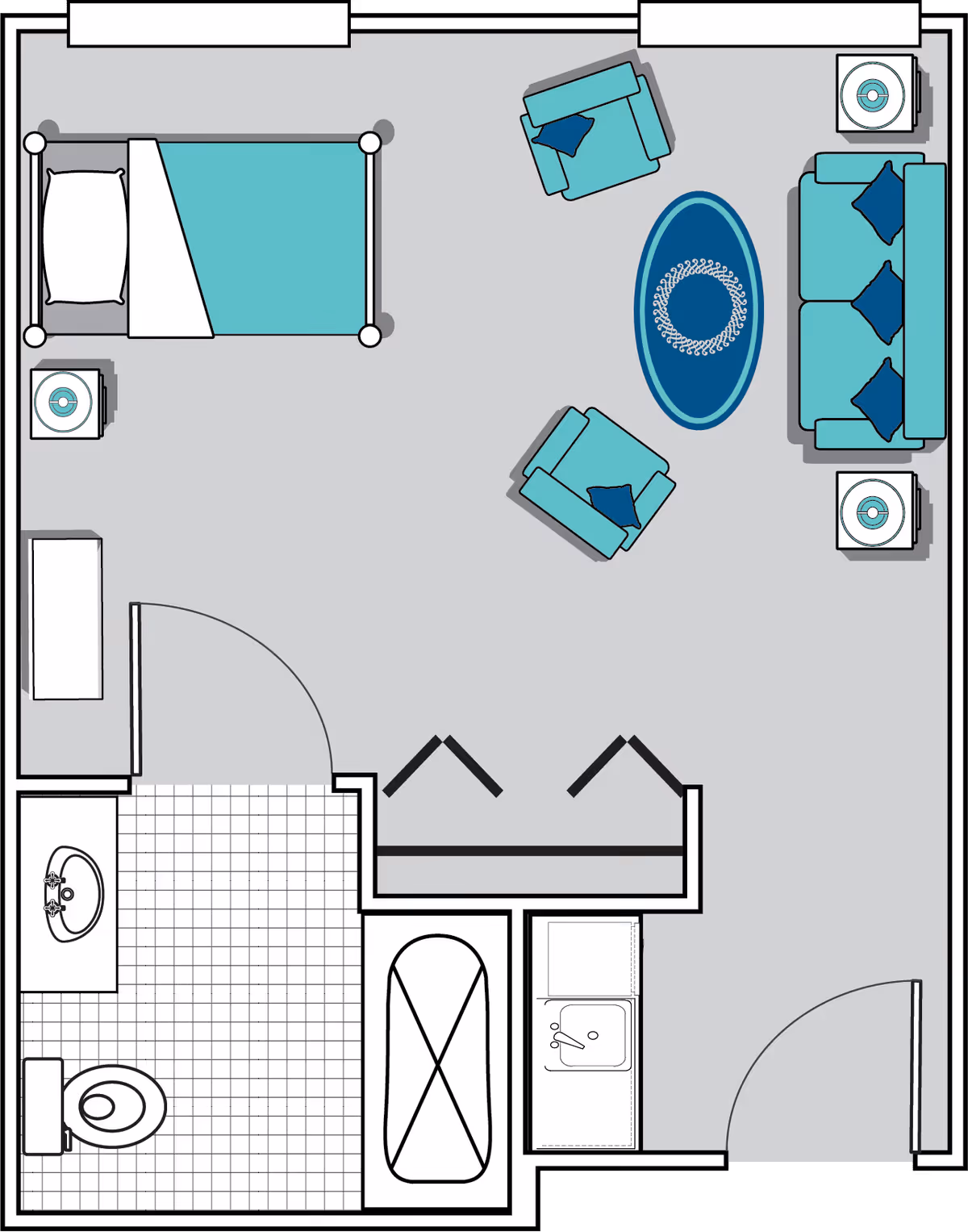 Floor plan of a senior living facility room at Oaks at Maple Ridge showing a bedroom area with a bed, two nightstands, a living area with a sofa, two armchairs, a round rug, and two side tables. The room includes a bathroom with a sink, toilet, and bathtub, and a small kitchenette with a sink.