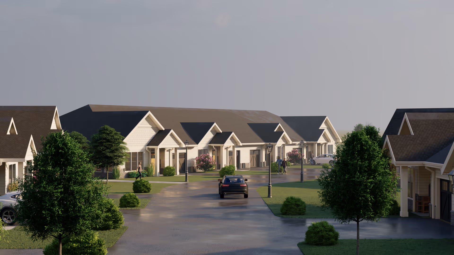 Driveway and landscaped courtyard lined with single-story cottage-style senior living buildings, a parked car, and a few people walking.