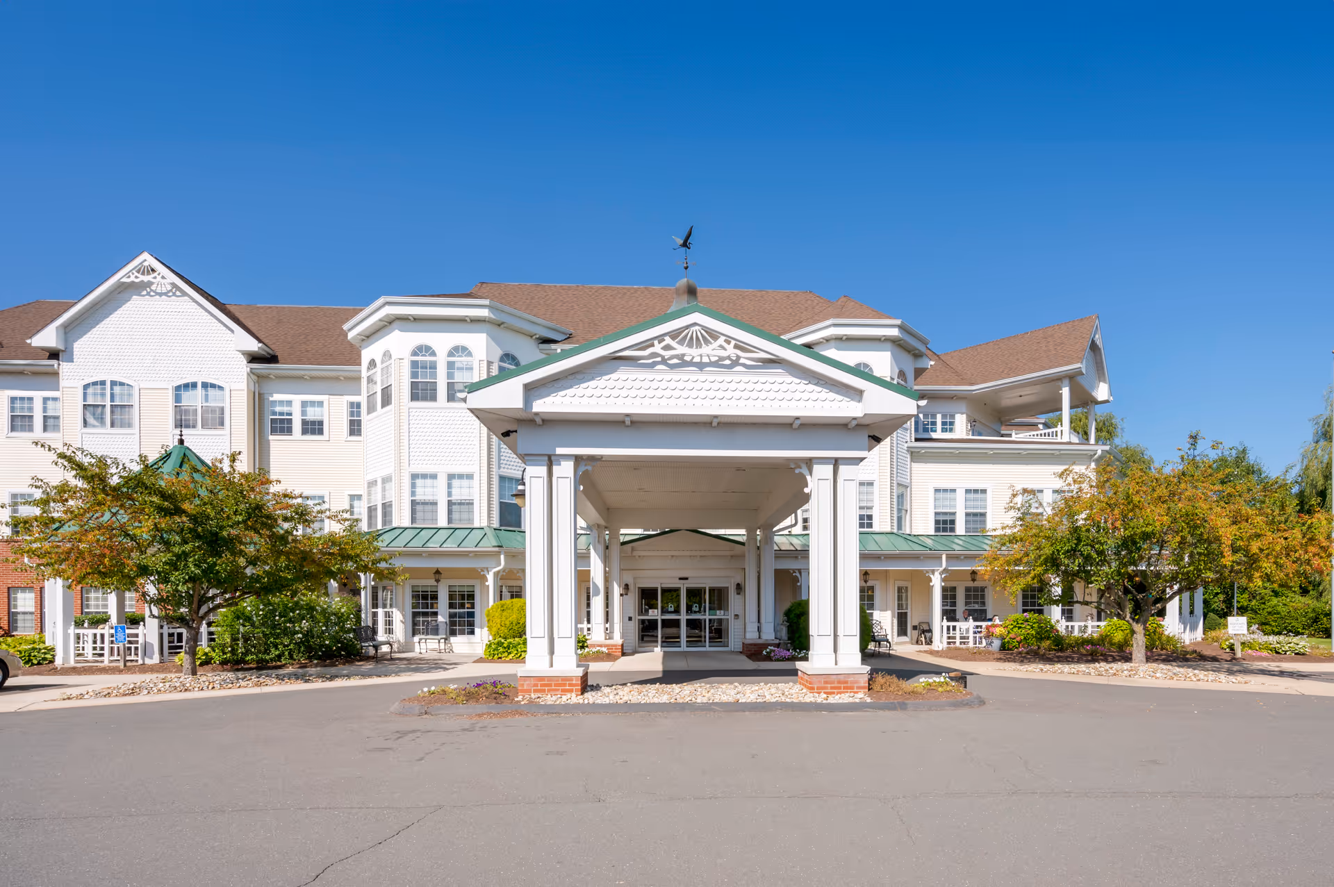 Exterior of Brookdale South Windsor, showing a covered entrance and landscaped grounds.
