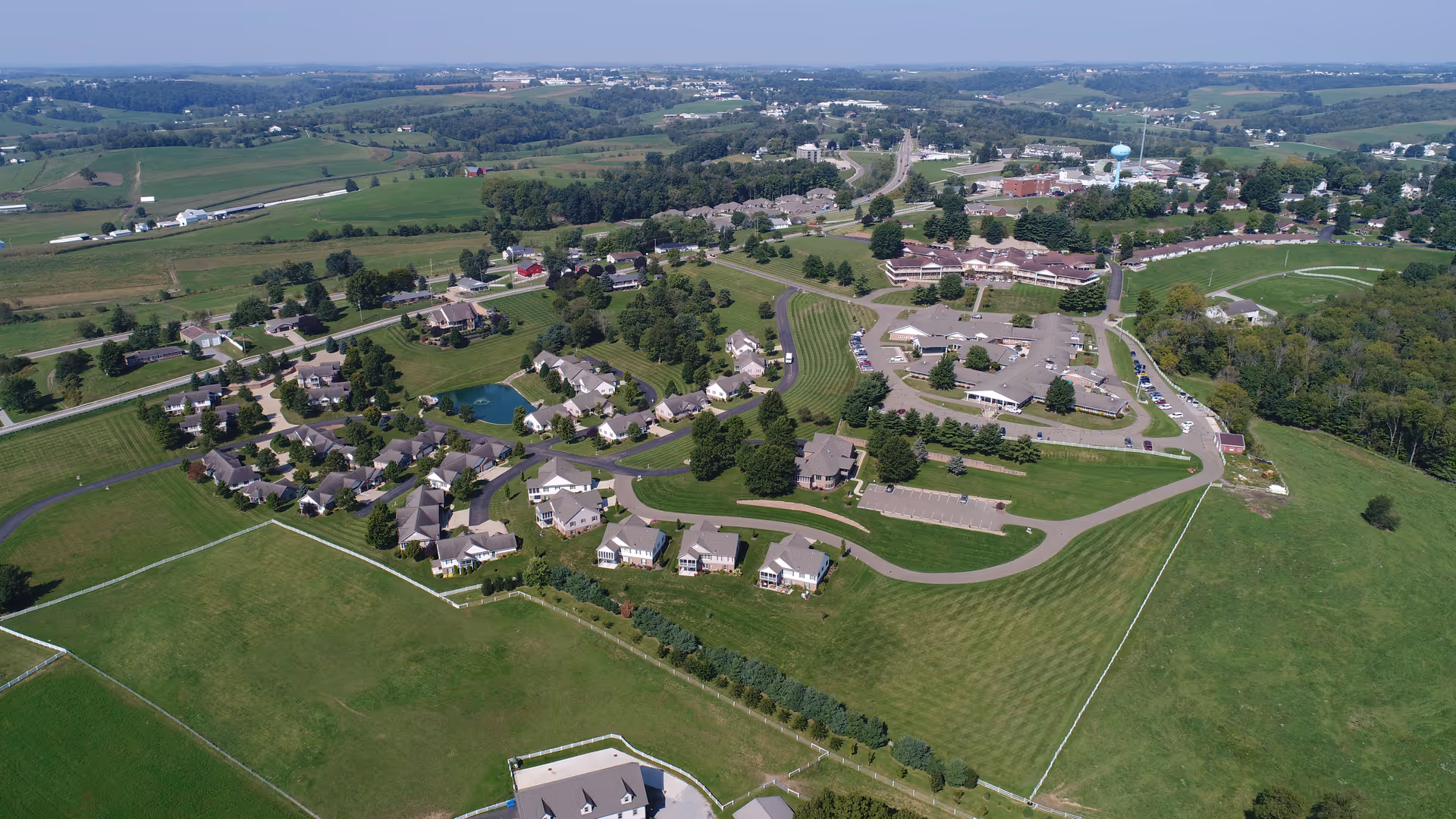 Aerial view of Walnut Hills Retirement Home campus with clustered buildings and green surroundings.