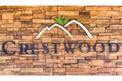 Stone exterior with Crestwood logo and sign reading Crestwood Rehabilitation and Nursing.