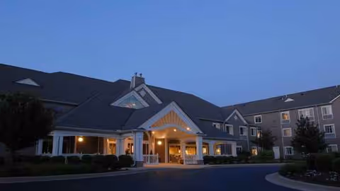 Dusk exterior view of Celebration Villa of Newburgh entrance and front facade