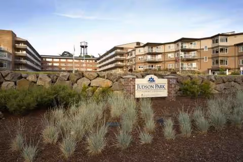 Exterior view of Judson Park Health Center with landscaping and a front sign