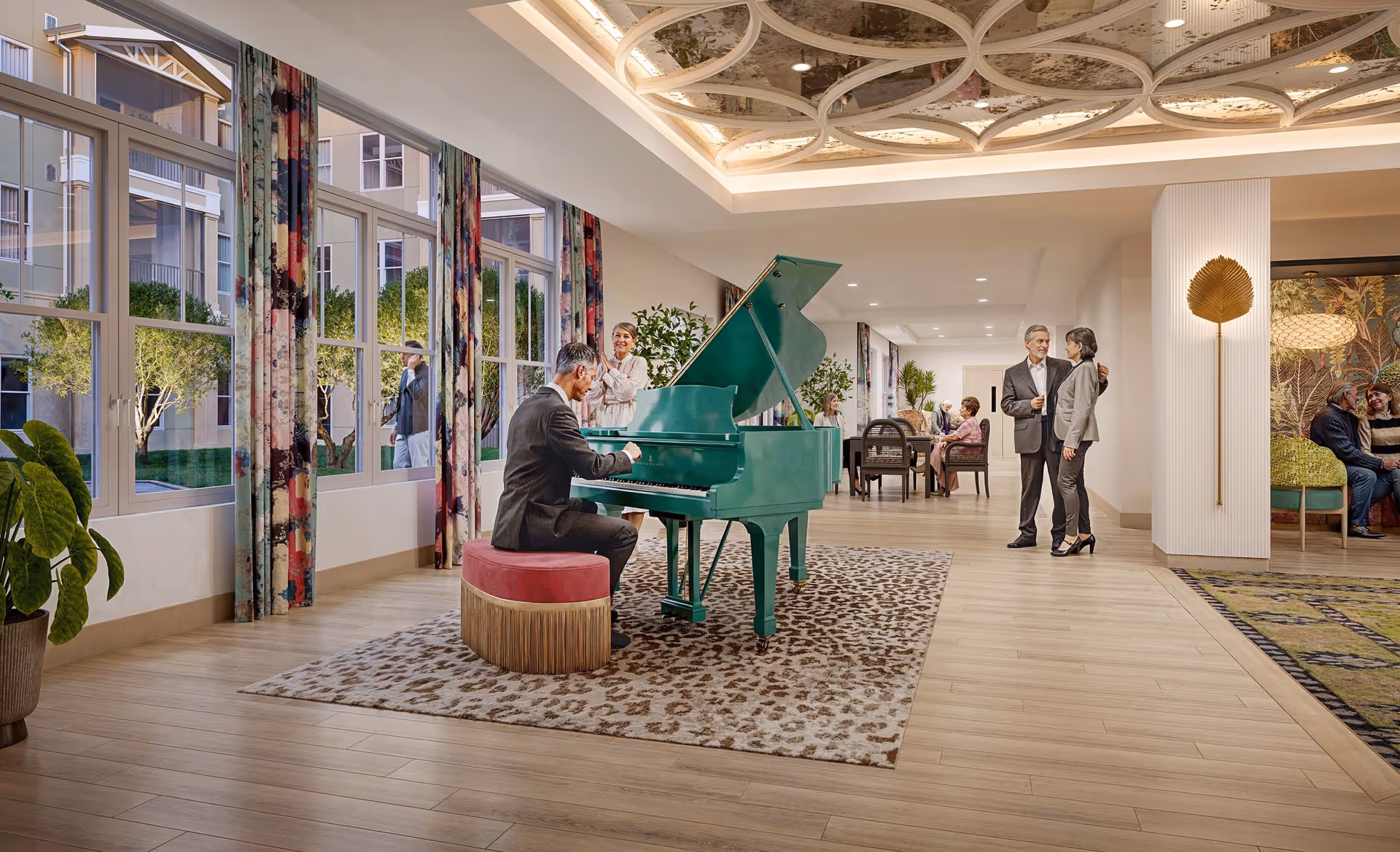 Bright communal lounge with a teal grand piano, people socializing, large windows, and a decorative ceiling.