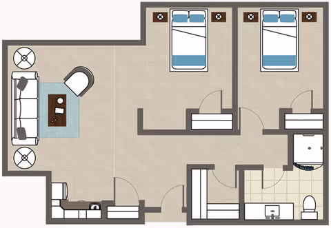 Floor plan of a residential unit showing two bedrooms each with a bed and nightstands, a living room with a sofa, chair, coffee table, and side tables, a kitchen area, and a bathroom with a shower, sink, and toilet.