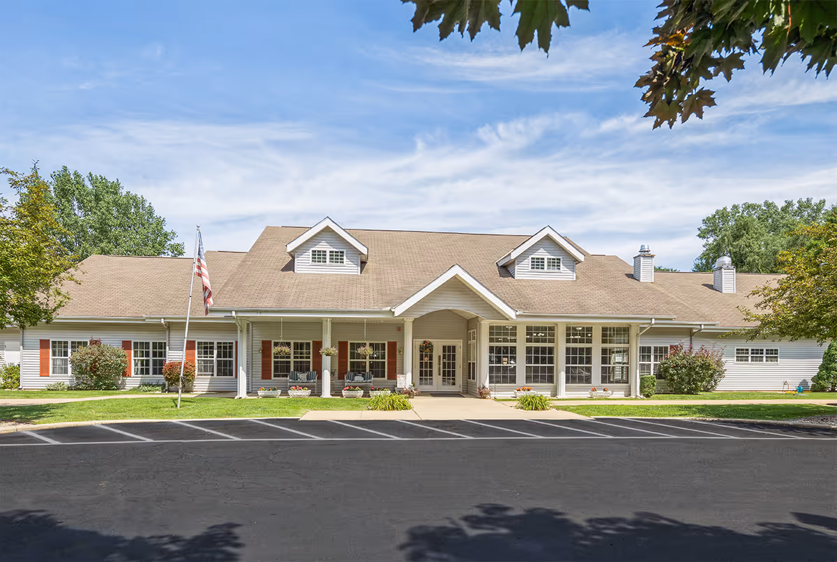 Front exterior of a single-story senior living facility with a central entrance.