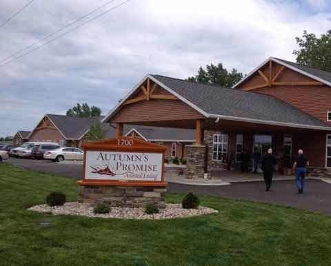 Exterior view of Autumn's Promise Assisted Living building with a sign and entrance.