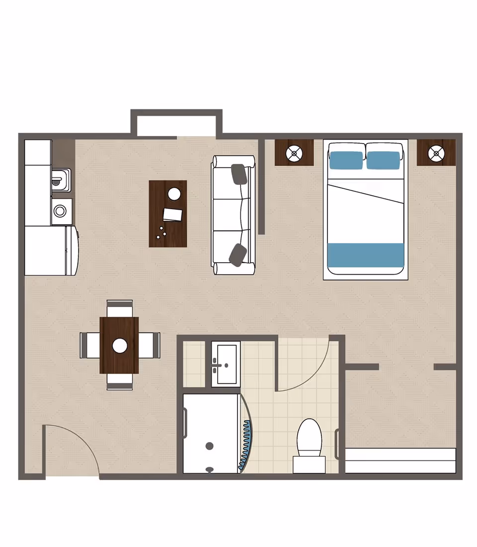 Floor plan of a one-bedroom assisted living unit showing a combined kitchen and living area with a sofa and coffee table, a dining table with four chairs, a bedroom with a double bed and two nightstands, and a bathroom with a shower, sink, and toilet.