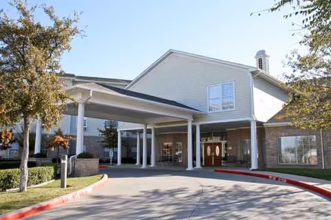 Front entrance of The Waterford at Fort Worth with a covered porte-cochere