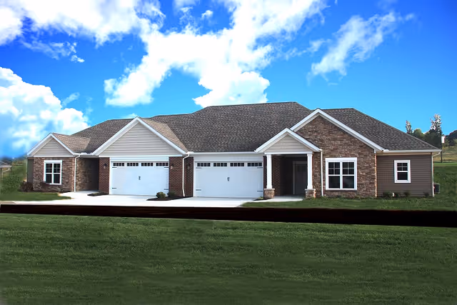 Front exterior of a single-story senior living building with three garage doors, brick and siding facade, lawn and blue sky.