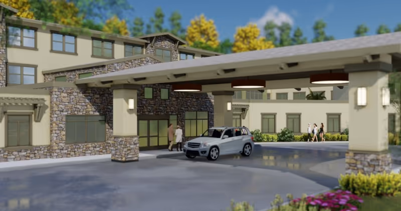 Exterior view of The Grove at Los Gatos entrance with a drop-off canopy and car.