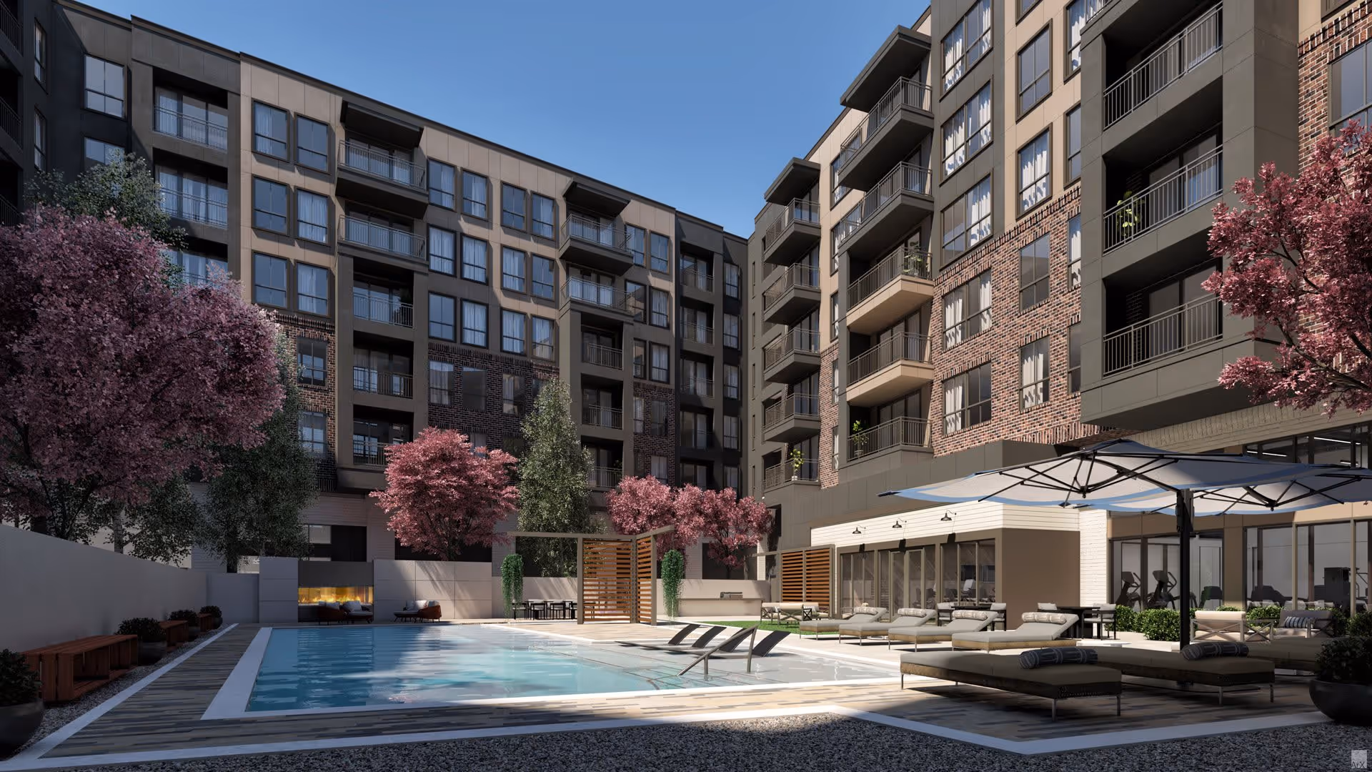 Outdoor courtyard featuring a swimming pool, lounge chairs, umbrellas, and a multi-story apartment building with balconies.