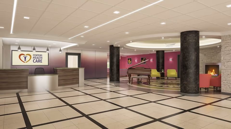 A spacious and modern reception area with a checkered tile floor, a reception desk with a sign reading 'Centers Health Care,' and a lounge area featuring a grand piano, colorful chairs, and a fireplace.