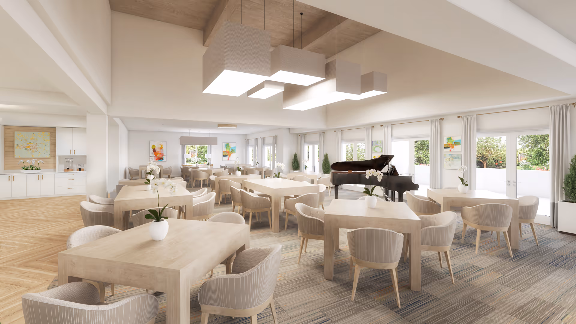Bright communal dining and activity room with light wood tables and chairs, a grand piano, large windows, and modern pendant lights.