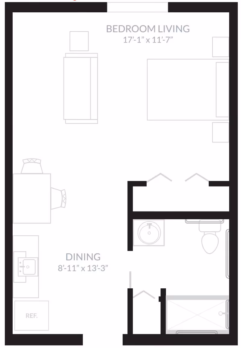 Floor plan layout of a living space labeled 'Inspired Living Kenner' showing a bedroom living area measuring 17 feet 1 inch by 11 feet 7 inches, a dining area measuring 8 feet 11 inches by 13 feet 3 inches, a kitchen area with a refrigerator and sink, and a bathroom with a sink, toilet, and shower.