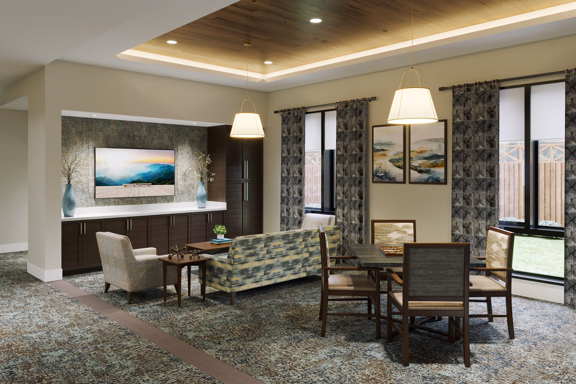 A cozy living room area with a patterned carpet, a sofa, an armchair, a wooden coffee table, and a TV mounted on a textured wall. There is a dining table with four chairs near large windows with patterned curtains, and two pendant lights hanging from a wooden ceiling panel.