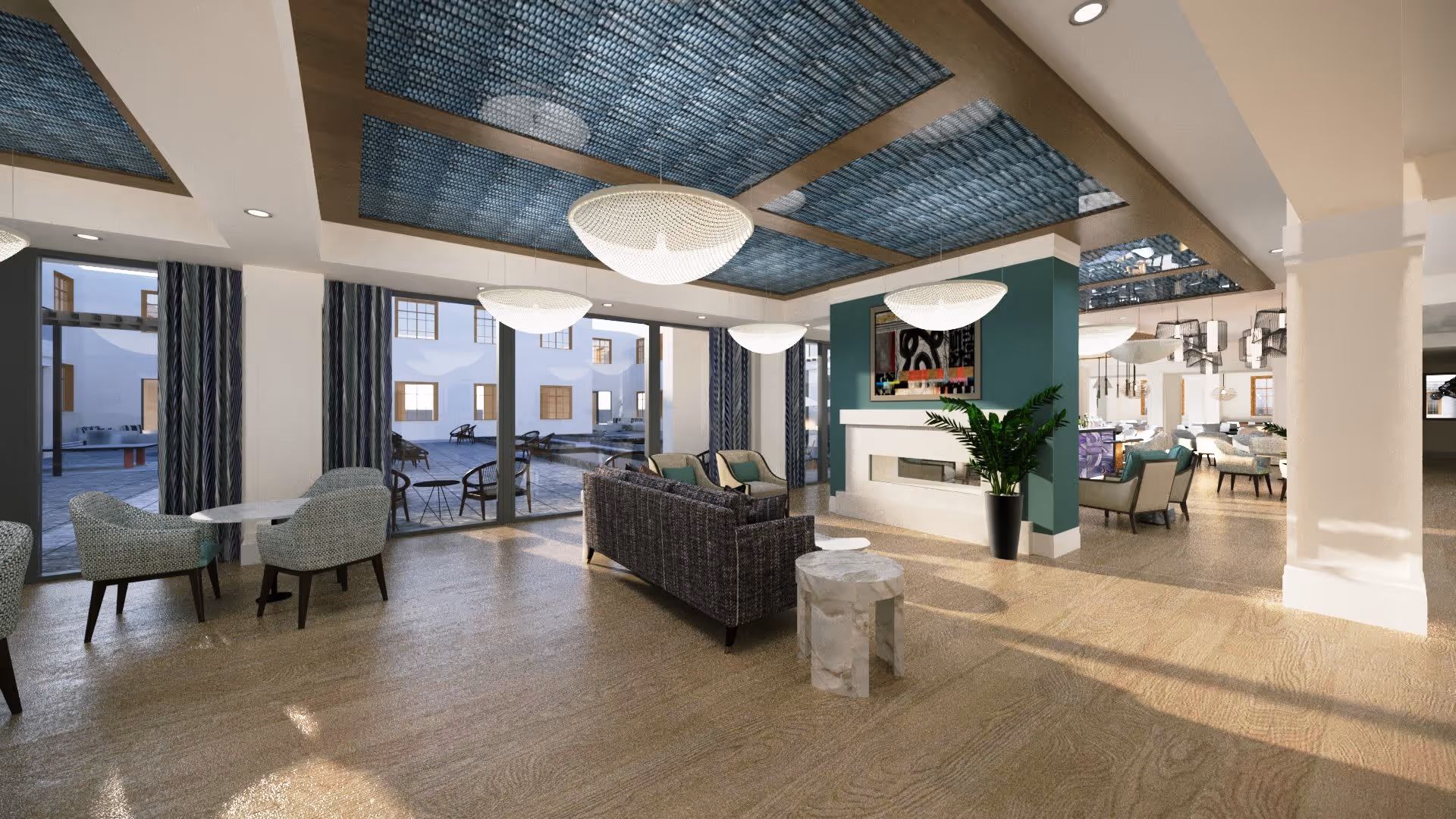 A spacious and modern living room area with large windows looking out to an outdoor patio. The room features a dark woven sofa, two armchairs, a white fireplace with a colorful abstract painting above it, and several round tables with chairs. The ceiling has blue decorative panels and large round pendant lights. The floor is light wood, and there are plants adding greenery to the space.