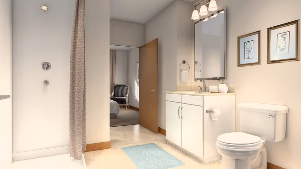 Bright modern bathroom featuring a shower with a curtain, white vanity and mirror, toilet, and an open door to a bedroom.