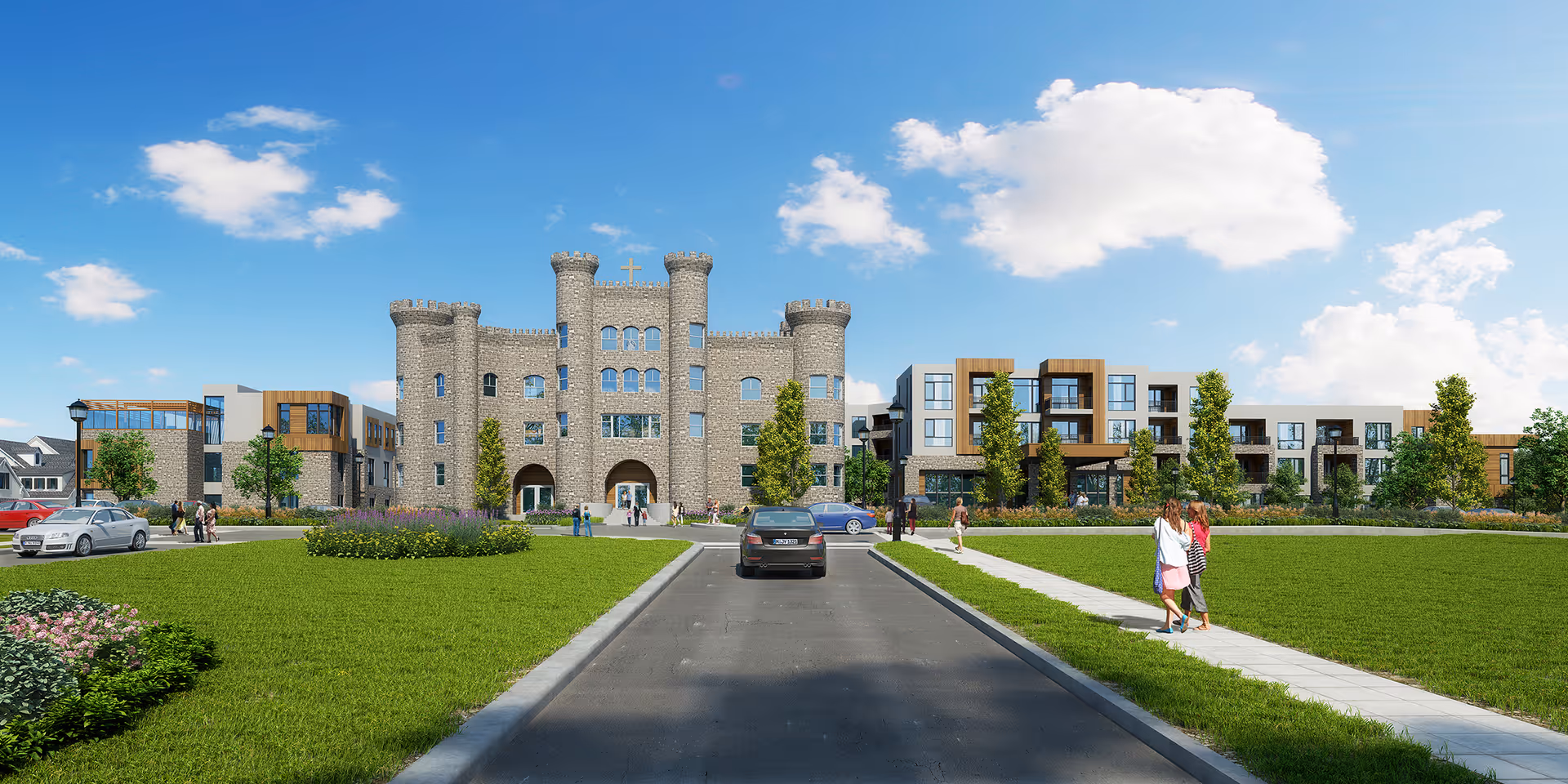 Front exterior view of The 501 at Mattison Estate, featuring a large castle-like stone building with towers and a cross on top, flanked by modern apartment-style wings. A paved driveway leads up to the entrance, with green lawns and landscaped bushes on either side. Several people are walking on the sidewalks, and cars are parked near the building under a partly cloudy blue sky.