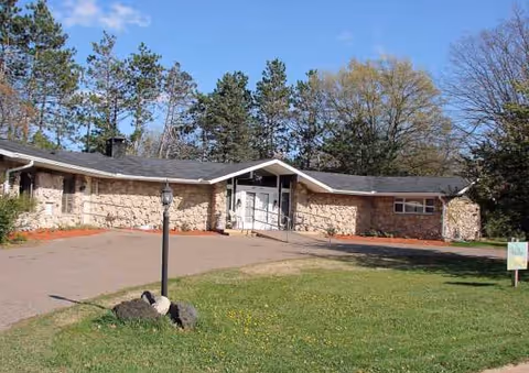 Front exterior view of Willow Haven CBRF, a single-story brick-and-stone senior living facility.
