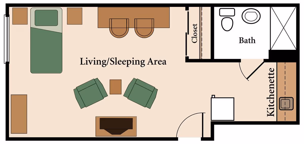 Floor plan of a studio apartment at The Amber showing a living/sleeping area with a bed, two chairs, a small table, a closet, a kitchenette, and a bathroom with a toilet, sink, and shower.