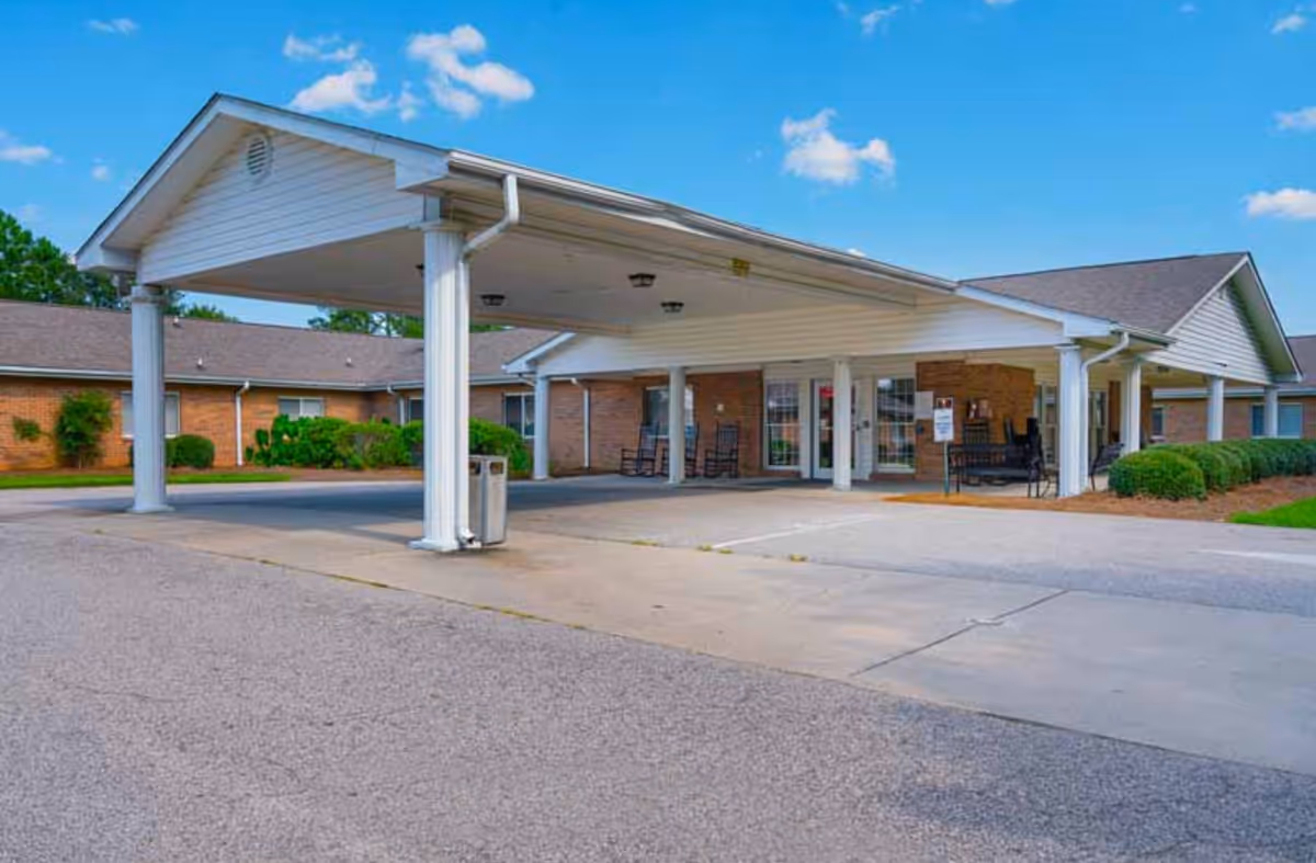 Exterior view of Wilson Healthcare and Rehabilitation Center entrance with covered driveway.