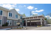 Exterior view of Edgewood Summit with a covered entrance and driveway.