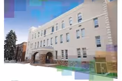 Front exterior of Ridgeview Healthcare & Rehabilitation Center, a beige multi-story building with arched entrance.