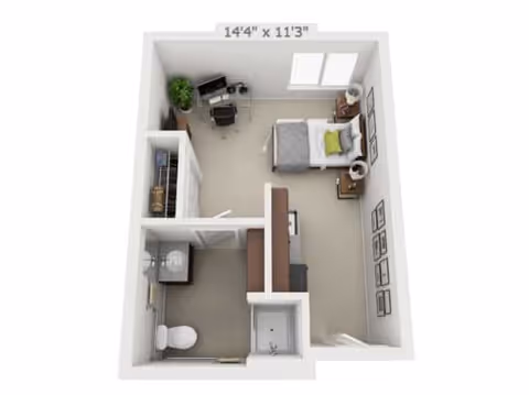 3D floor plan of a small studio apartment at Pine Grove Crossing featuring a combined bedroom and living area with a bed, nightstand, desk, and chair. The layout includes a separate bathroom with a toilet, sink, and shower, and a closet near the entrance. The room dimensions are 14 feet 4 inches by 11 feet 3 inches.