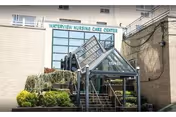 Exterior view of Waterview Nursing & Rehabilitation Center entrance with stairs and a ramp.