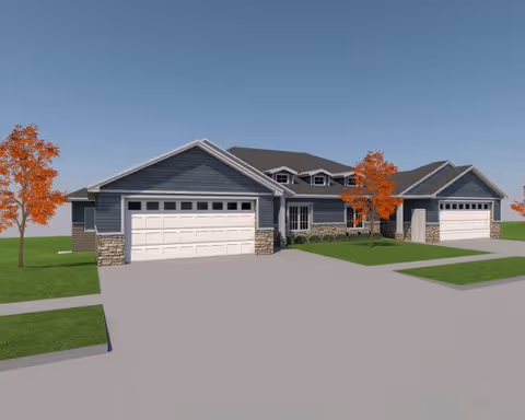 Exterior view of a single-story residential building with blue siding, stone accents, and two attached garages. The building is surrounded by green grass and a few trees with orange leaves under a clear blue sky.