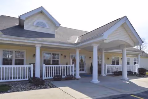 Clen-Moore Place senior living facility with a covered porch and white columns.