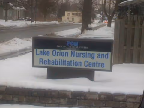 Snowy exterior view of a sign for Lake Orion Nursing and Rehabilitation Centre.