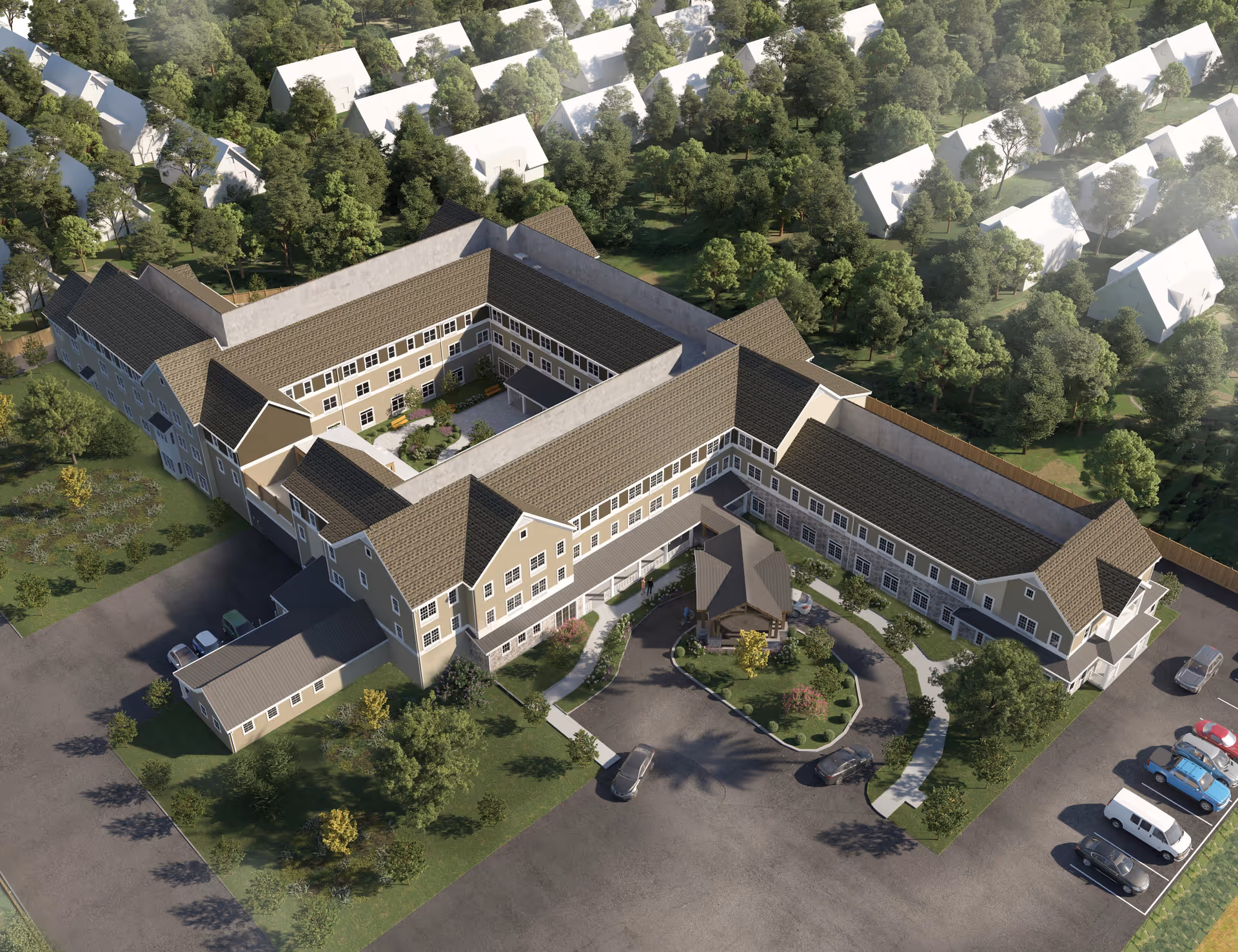 Aerial view of Ridgewood Senior Living at Historic Smithville, showing a large U-shaped building with a central courtyard garden. The building is surrounded by trees and greenery, with a parking lot and several cars visible in front. The facility has multiple floors with numerous windows and a covered entrance area.