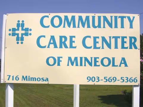 Outdoor sign reads Community Care Center of Mineola with address and phone number.