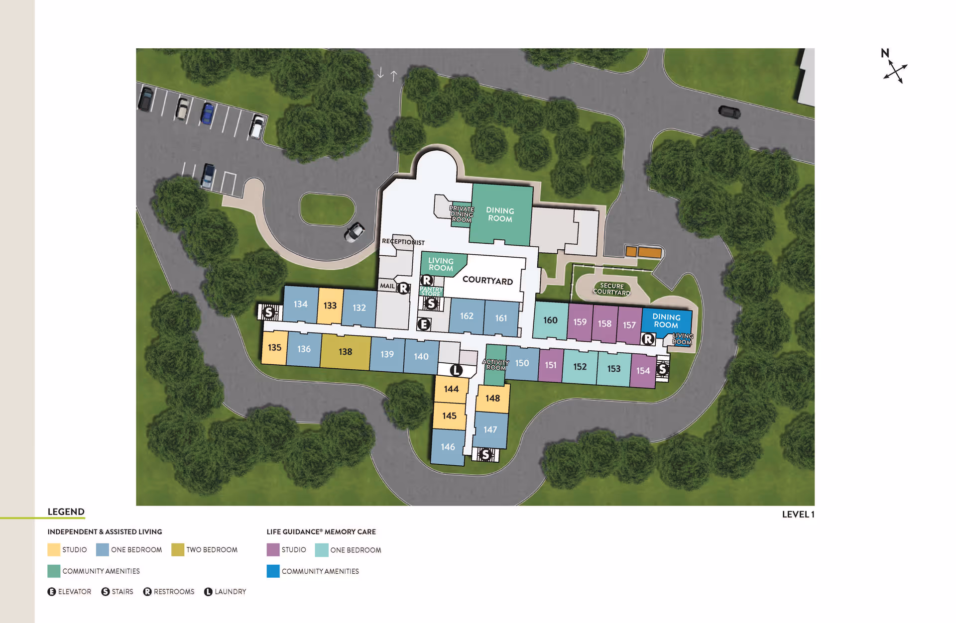 Floor plan of Atria Kennebunk Level 1 showing layout of independent and assisted living studios, one-bedroom and two-bedroom apartments, life guidance memory care studios and one-bedroom apartments, community amenities including dining rooms, living rooms, courtyard, secure courtyard, receptionist area, mail room, elevator, stairs, restrooms, and laundry. The plan is surrounded by trees and parking areas with a north directional compass.